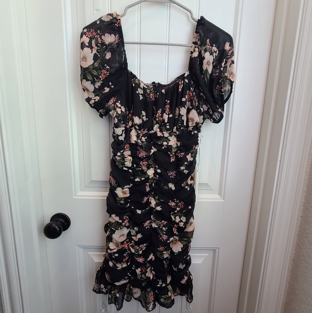 NWT Form fitting black dress with floral